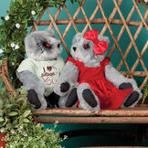 15" Zombie Love and Zombie Sweetheart Bear - Seated on a bench in a garden jointed bears with blackened eyes, embroidered scars and red heart tattoo on right arms wearing torn t-shirt and jeans and red velvet dress and hairbow - gray fur image number 1