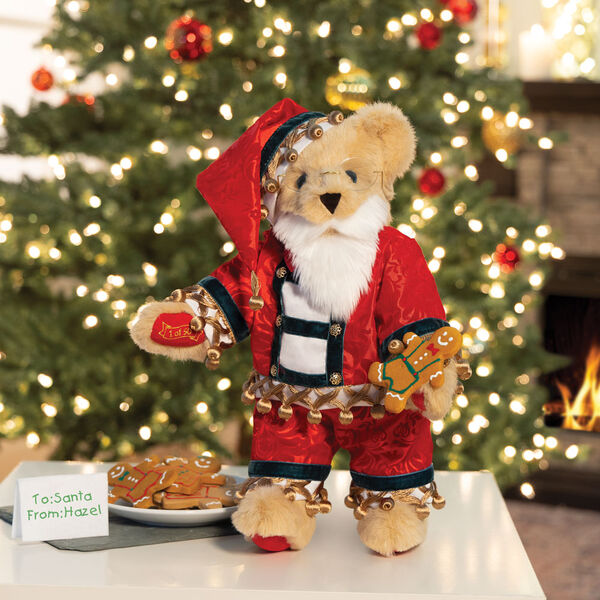 15" Limited Edition Christmas Cookie Santa Bear - Standing jointed buttercream bear with blue eyes wearing satin pajamas, a matching nightcap, a white beard, and glasses and holding a cookies and list. image number 0