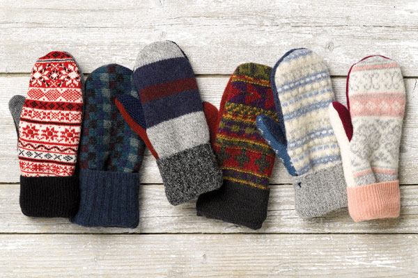 An image of 6 unique pairs of Vermont Mitten Company mittens in various colors, textures and patterns