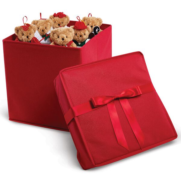 12 Days of Christmas Ornament Set - Red fabric box with satin ribbon has the cover off to the side and 6 light brown bears dressed in Christmas costumes are peeking out over the top.  image number 1