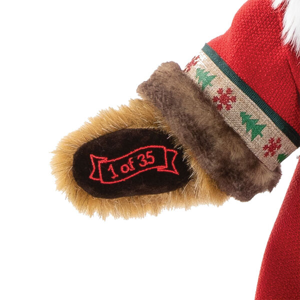 15" Limited Edition Woodland Santa Bear - Close up of bear's left paw with "1 of 35" embroidered in gold lettering