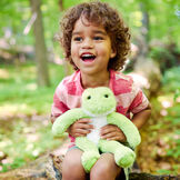 15" Buddy Frog - Plush green slim frog sitting in a forest with a child image number 7