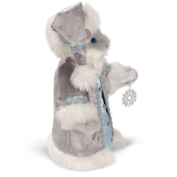 15" Limited Edition Snowflake Santa - Side view of gray standing bear in a silver and fur long coat with crystal snowflake