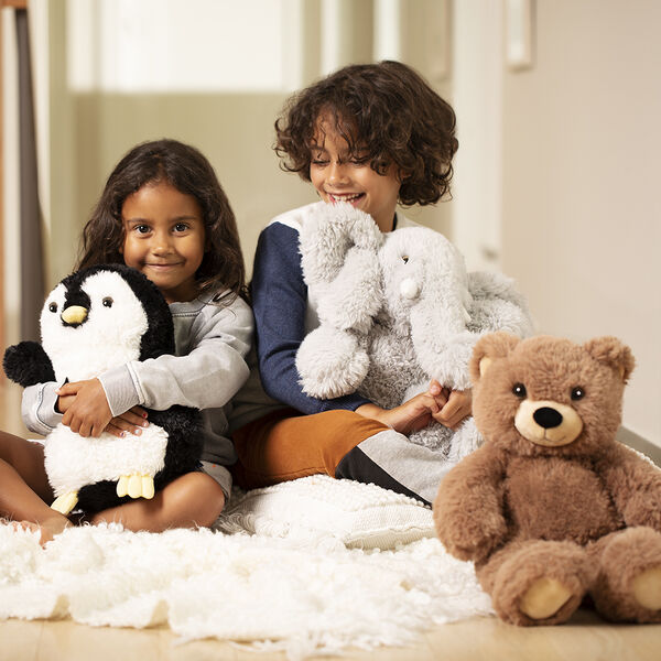 18" Oh So Soft Teddy Bear - Front view of honey brown teddy bear with penguin and elephant and children image number 8