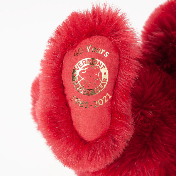 20" Special Edition 40th Anniversary Bear - Close up of red foot pad with metallic gold Vermont Teddy Bear logo, "40 Years" amd 1981-2021".  image number 1