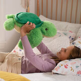 18" Oh So Soft Turtle- Green and yellow turtle in a bedroom scene with model image number 2