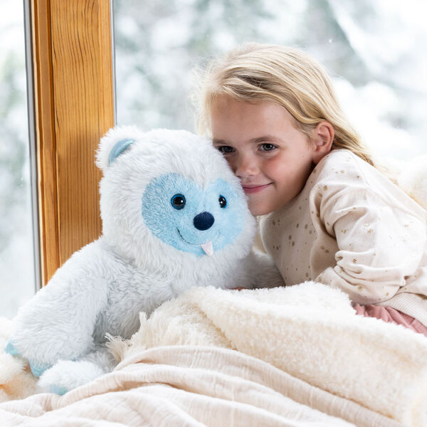 18" Fluffy Fantasy Yeti - Front view of white seated stuffed animal Yeti in a bedroom scene with child image number 2