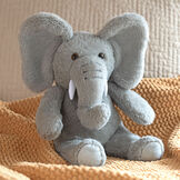 13" Elephant Snuggle Pal - Seated grey elephant weighted stuffed animal in bed image number 2