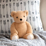 13" Bear Snuggle Pal - Seated light brown bear weighted stuffed animal in bedroom scene image number 2