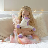 13" Unicorn Snuggle Pal - Seated front view of ivory unicorn weighted stuffed animal with model in bedroom scene image number 1