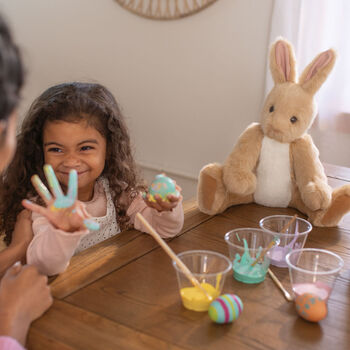 16" Classic Buttercream Bunny Rabbit - Seated jointed buttercream rabbit with vanilla belly and brown eyes in Easter scene with model