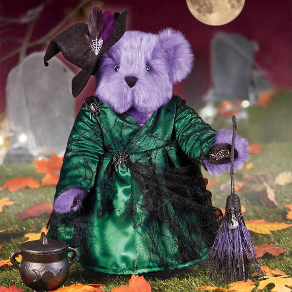15" Limited Edition Toil and Trouble Witch - Front view of standing jointed purple bear with green dress with black spider web lace, broom, witch's hat and cast iron cauldron in Halloween scene image number 1