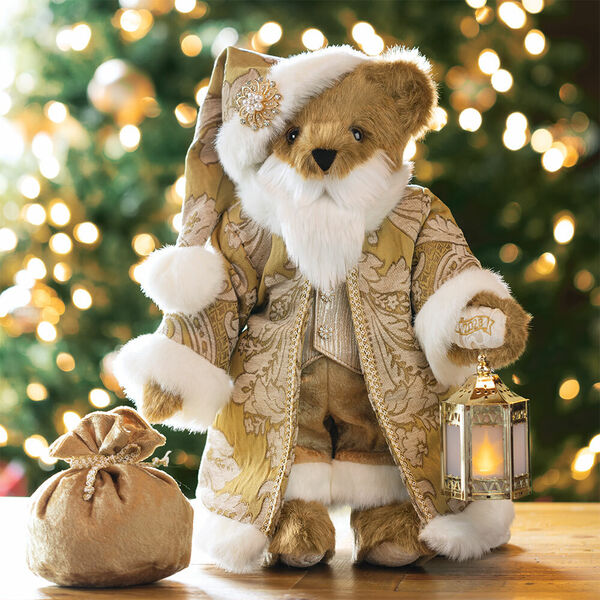 15" Limited Edition Gilded Santa Bear - Standing jointed honey bear with gold fur lined coat, vest, pants and hat holding a lantern presented as a Christmas gift image number 0