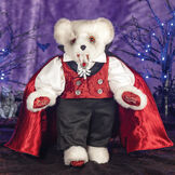 15" Limited Edition Count Dracula Vampire Bear - Standing jointed vanilla bear with fangs and orange eyes dressed in a highly detailed cape, vest, pants and shirt in a Halloween decorative scene image number 1