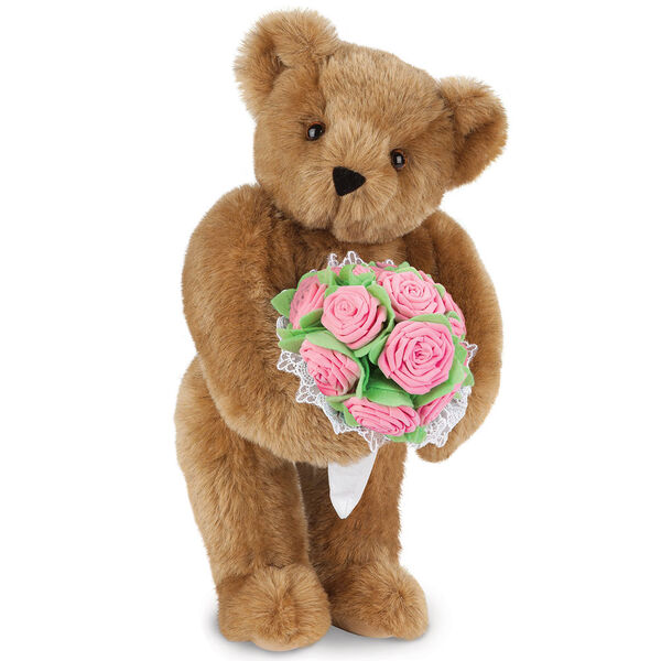 15" Pink Rose Bouquet Teddy Bear - Front view of standing jointed bear holding a large pink bouquet wrapped in white satin and lace - Honey brown fur image number 1