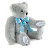 15" Premium Baby Boy Bear - Three quarter view of seated jointed gray bear with white paw pads and chose of eye color wearing a blue satin bow. All 4 paw pads are personalized with baby's name, birth date, pounds and inches at birth. image number 2