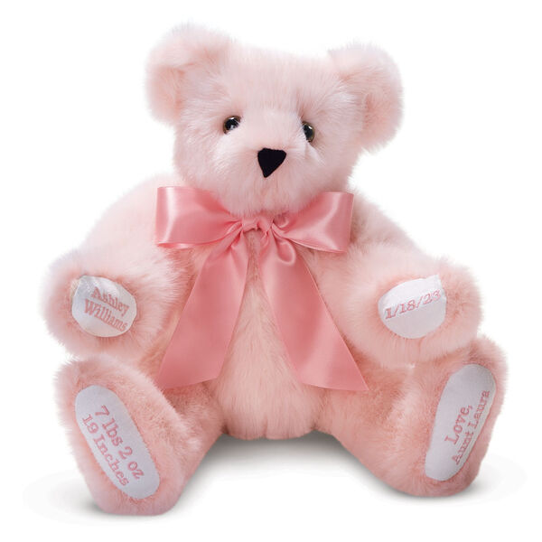 15" Premium Baby Girl Bear - Front view of seated jointed pink bear with white paw pads and chose of eye color wearing a blue satin bow. All 4 paw pads are personalized with baby's name, birth date, pounds and inches at birth.  image number 0