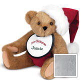 15" Baby's First Christmas Bear - Seated jointed bear dressed in red velvet diaper with santa hat and white and green bib that says ' First Christmas' in red lettering. Bib is personalized with "Jamie" in dark green lettering - Gray image number 6