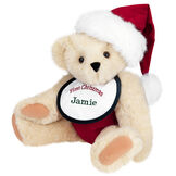 15" Baby's First Christmas Bear - Seated jointed bear dressed in red velvet diaper with santa hat and white and green bib that says ' First Christmas' in red lettering. Bib is personalized with "Jamie" in dark green lettering - Buttercream brown fur image number 3