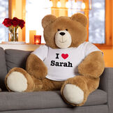 4' Big Hunka Love&reg; I HEART You T-Shirt Bear - Seated honey brown bear with white t-shirt personalized with "I Heart Sarah" in red and black graphics in Valentine's Day scene image number 2