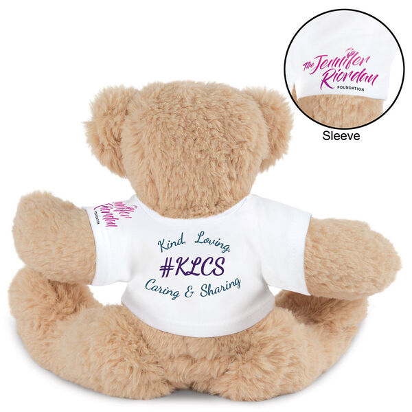 15" Spark Kindness Bear - Back view of seated soft caramel brown bear dressed in a white t-shirt with blue and purple graphics that says "#KLCS" surrounded by "Kind, Loving, Caring, and Sharing"  image number 1