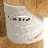 15" Classic Bear Cast - white plastic cast on bear's left leg. "Tough break" in black lettering and "Get Well Soon" in red lettering are written on the cast.  image number 0