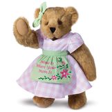 15" Home Is Where Your Mom Is Bear - Front view of standing jointed bear wearing a pink gingham dress, green bow and apron with floral embroidery and says "Home is Where Your Mom Is" - Honey brown fur image number 0