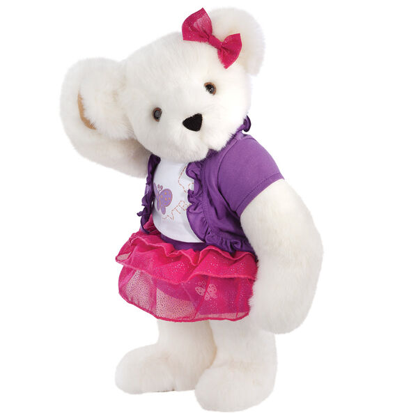 15" Glitter Whimsy Bear - Three quarter view of standing jointed bear dressed in a pink skirt and hair bow, white shirt with butterfly graphic, purple shorts and sweater - Vanilla white fur image number 2