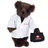 15" Doctor Bear - Front view of standing jointed bear dressed in white labcoat holding a doctor bag that is embroidered wth "FURst Aid" and a medical cross in red and white personalized with "Dr. Jones" on left chest in red - Espresso brown fur image number 4