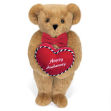 15" Happy Anniversary Bear - Front view of standing jointed bear dressed in a red velvet bow tie and holding a red heart pillow that says' Happy Anniversary" in white  - Honey brown fur image number 0