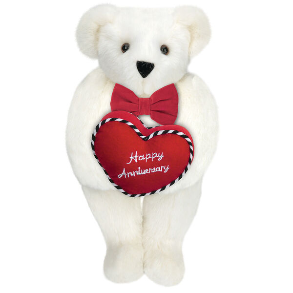 15" Happy Anniversary Bear - Front view of standing jointed bear dressed in a red velvet bow tie and holding a red heart pillow that says' Happy Anniversary" in white  - Vanilla white fur image number 2