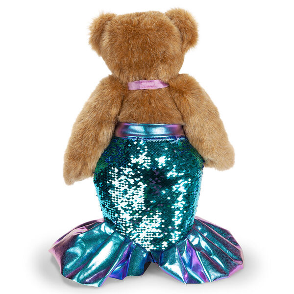 15" Mermaid Bear - Back view of standing jointed bear dressed in a blue sequin tail and purple top with shell embroidery an pink starfish applique and earpiece - honey brown fur image number 3