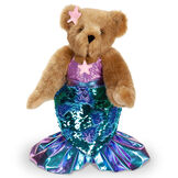 15" Mermaid Bear - Front view of standing jointed bear dressed in a blue sequin tail and purple top with shell embroidery an pink starfish applique and earpiece - honey brown fur image number 11