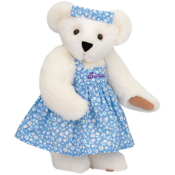 15" Mother Bear - Three quarter view of standing jointed bear dressed in blue floral dress and hair bow personalized with "Susan" in purple on bodice of dress - Vanilla white fur