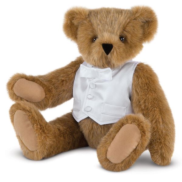 15" Special Occasion Boy Bear - Three quarter view of seated jointed bear dressed in a white satin vest and shirt front with bowtie - Honey brown fur image number 0