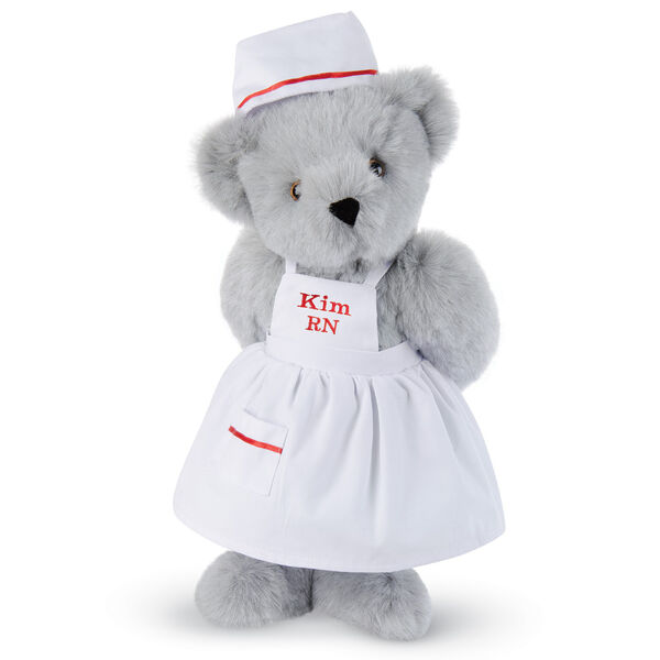15" Nurse Bear - Front view of standing jointed bear dressed in white nurse's dress and hat with red trim perosnlized with "Kim RN" on bib of dress in red - Gray fur