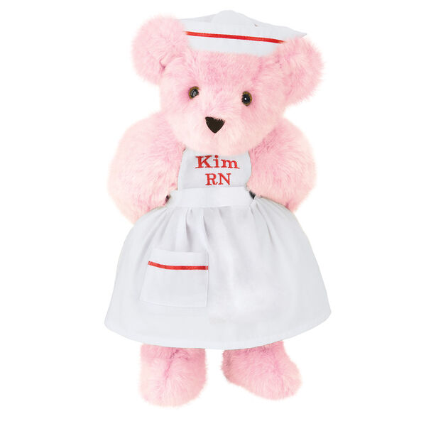 15" Nurse Bear - Front view of standing jointed bear dressed in white nurse's dress and hat with red trim perosnlized with "Kim RN" on bib of dress in red - Pink fur
