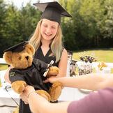 15" Graduation Bear in Black Gown - Front view of standing jointed bear dressed in black satin graduation gown and cap presented as a kid's Graduation gift image number 1