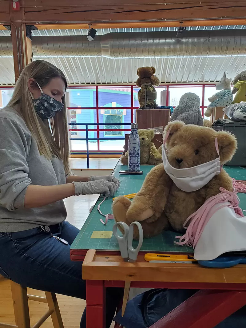 An image of a worker making a teddy bear