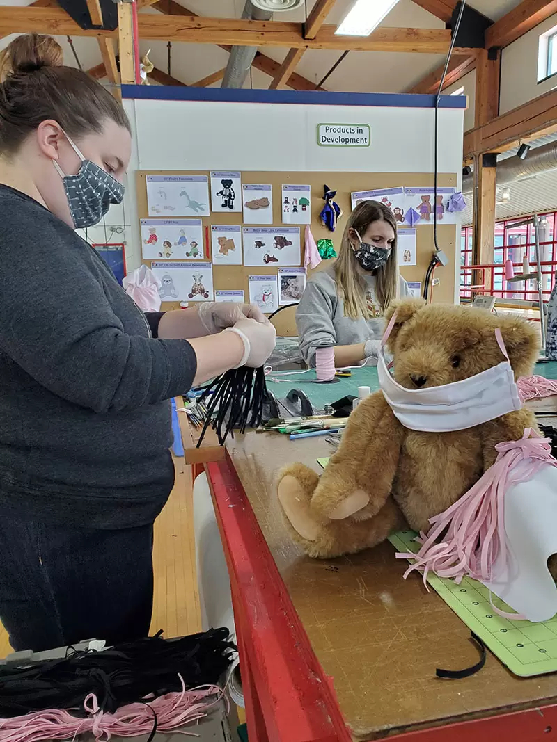 An image of workers making teddy bears